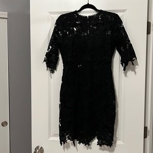 Lulus black lace mini dress. Lace see through mid section